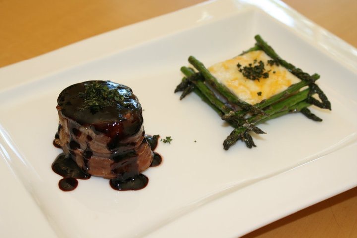 Beef tournedos with red wine reduction and asparagus gratin