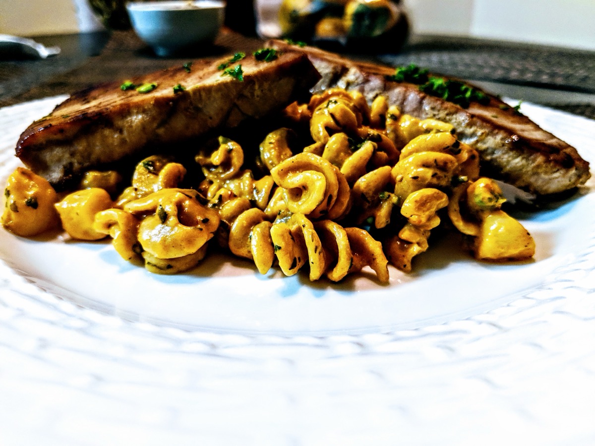 Grilled pork ribs with rotini pasta and mushroom cream sauce
