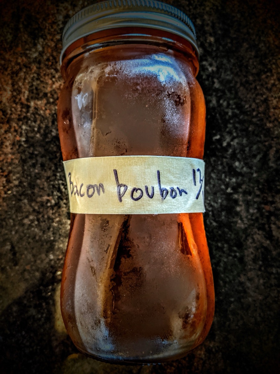 Jar of homemade bacon bourbon infusion