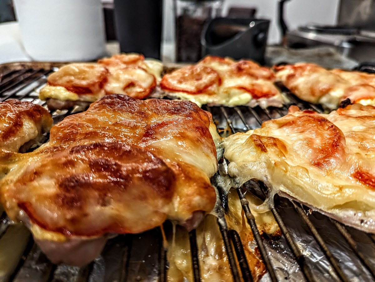 Grilled chicken with tomato and melted cheese