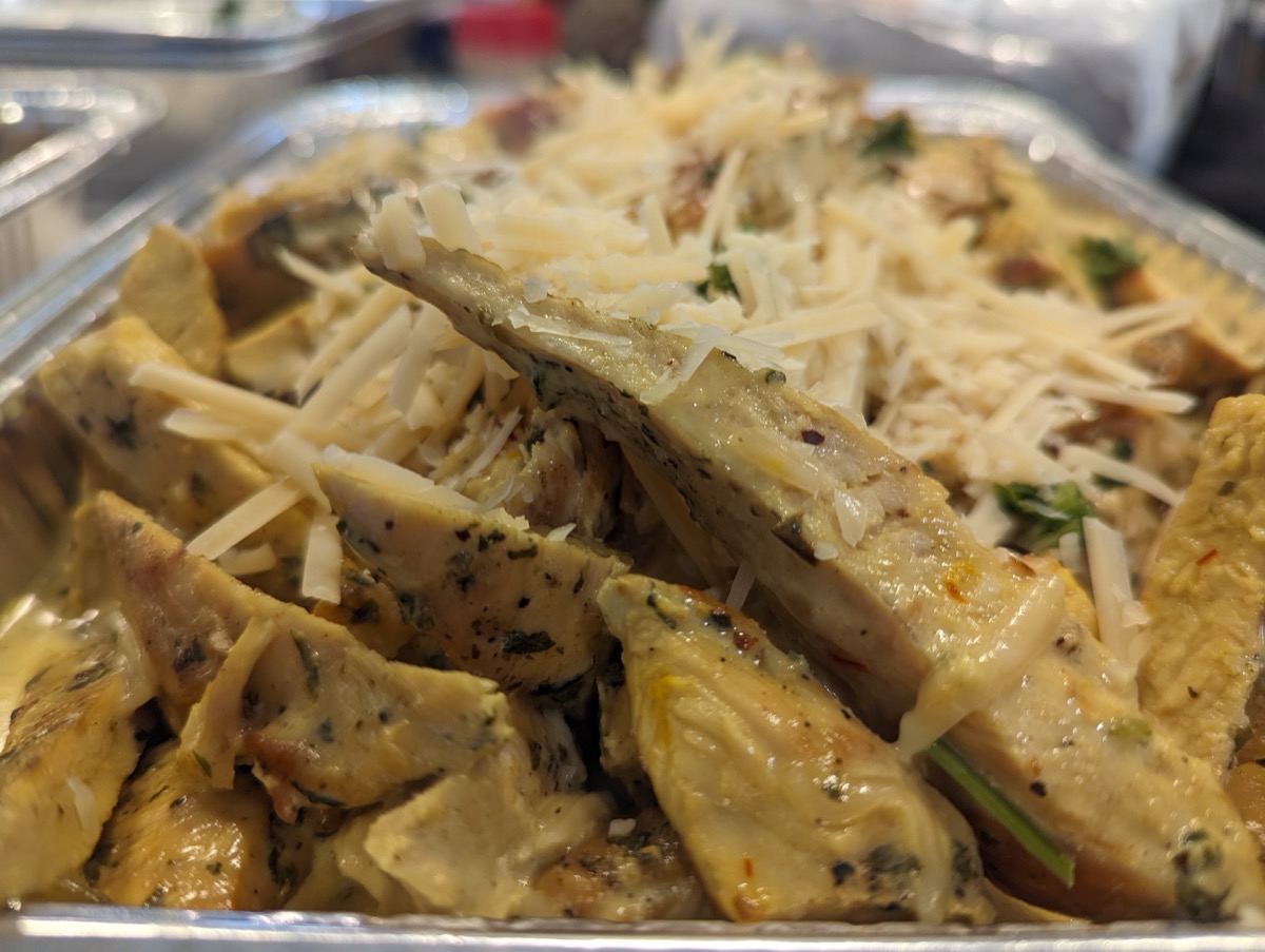 Sliced herb chicken with shaved Parmesan