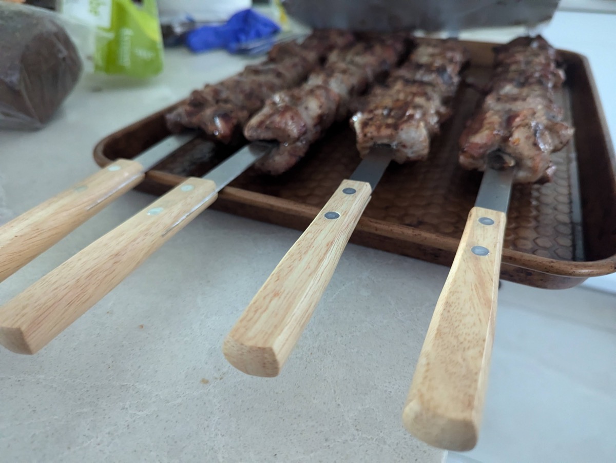 Beef shashlik skewers on a tray ready for the grill