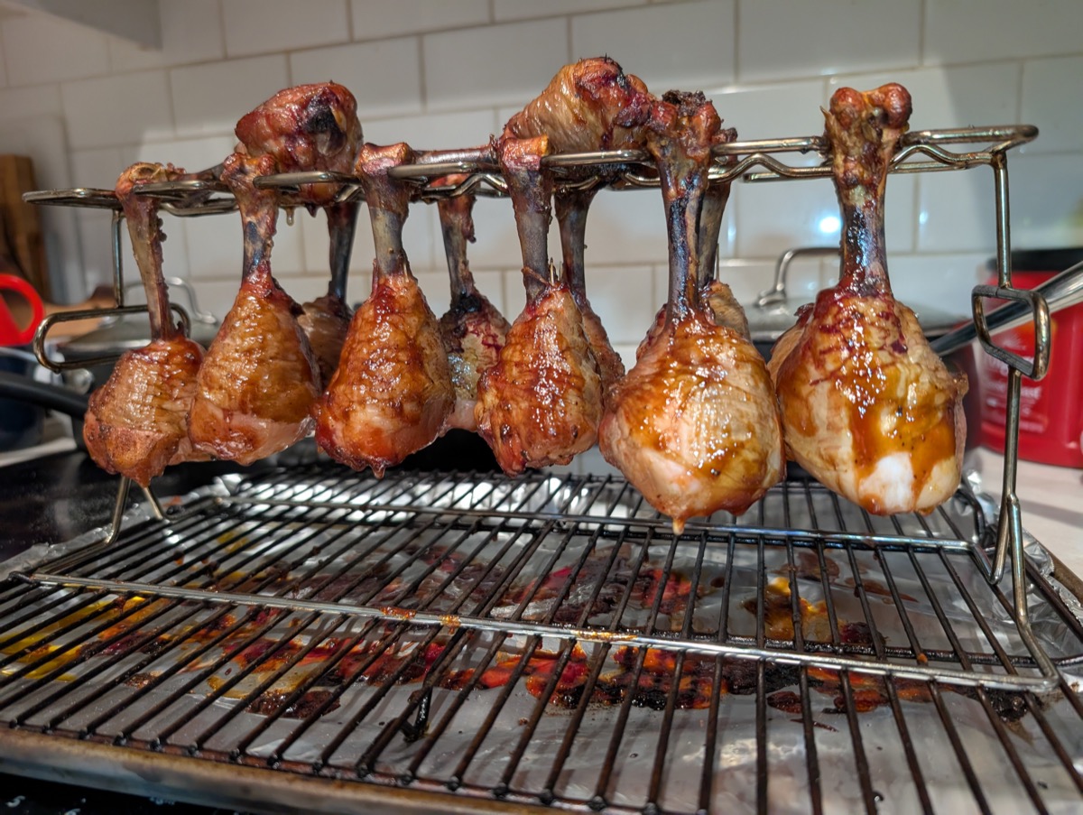 Glazed chicken drumsticks on a rack