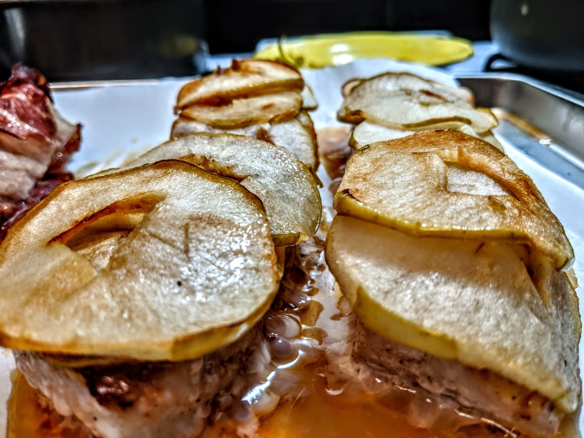 Pork loin topped with roasted pear slices